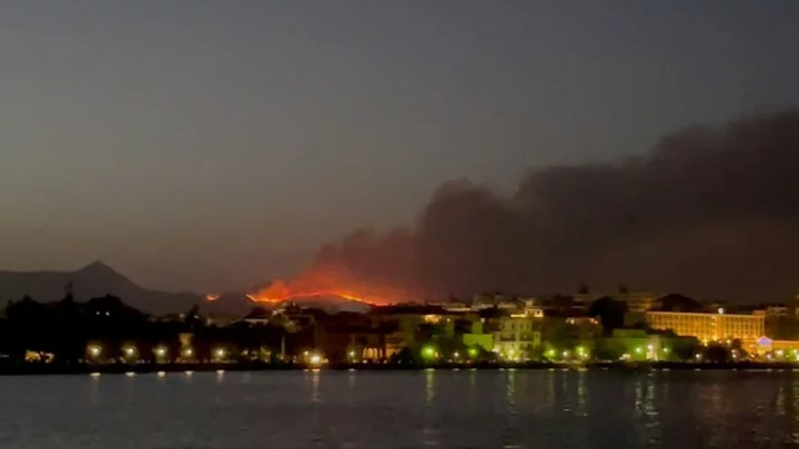 Tourists flown home as wildfires rage on Greek islands