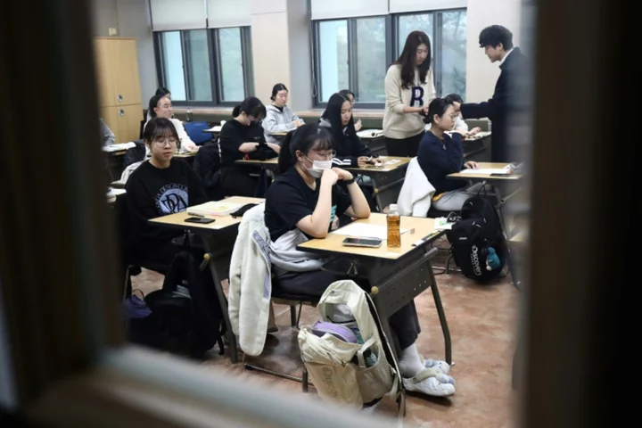 South Koreans sit key exam as flights halted to limit distraction