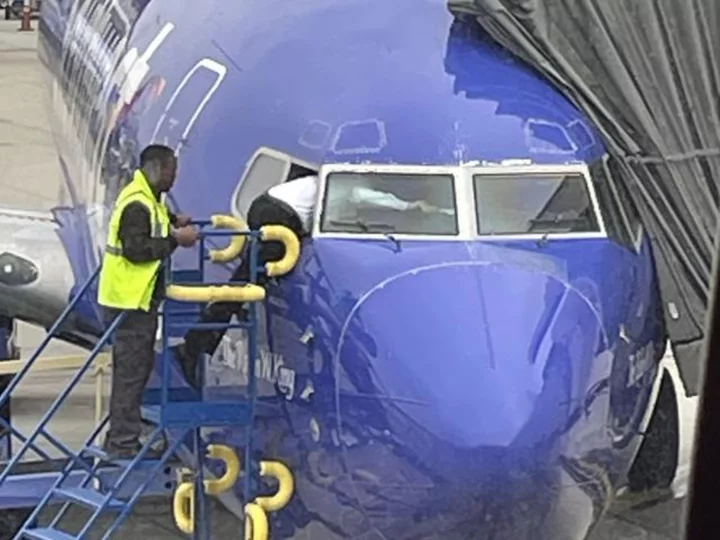 A Southwest pilot had to crawl into the cockpit window after the flight deck door was locked