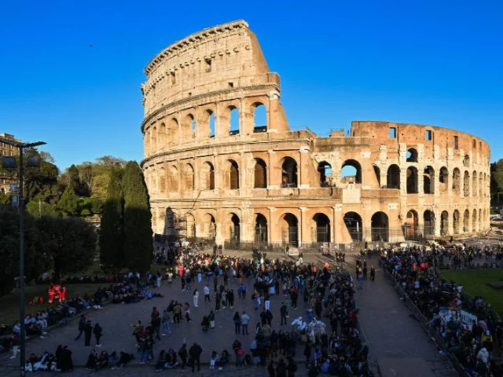 Tourist filmed carving his girlfriend's name into Rome's Colosseum