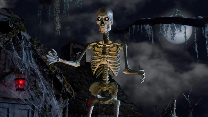 Home Depot's viral 12-foot skeleton is back in stock with a new lighting kit and a $40 mini-me