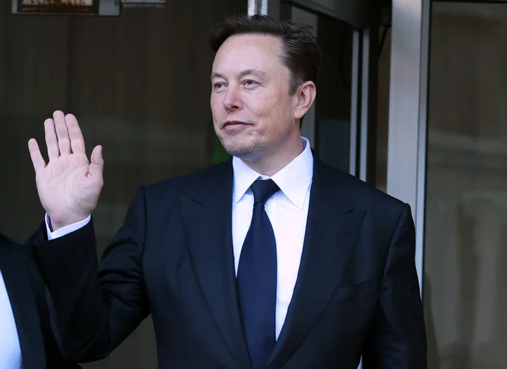 What’s Trending Today: Musk in China, Air New Zealand Passenger Weigh-In, Holmes Heads to Jail