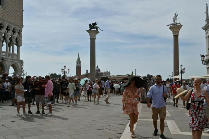 Venetians plead 'please don't come' as tourists jam city