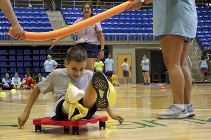 Camp for kids with limb differences also helps train students in physical and occupational therapy